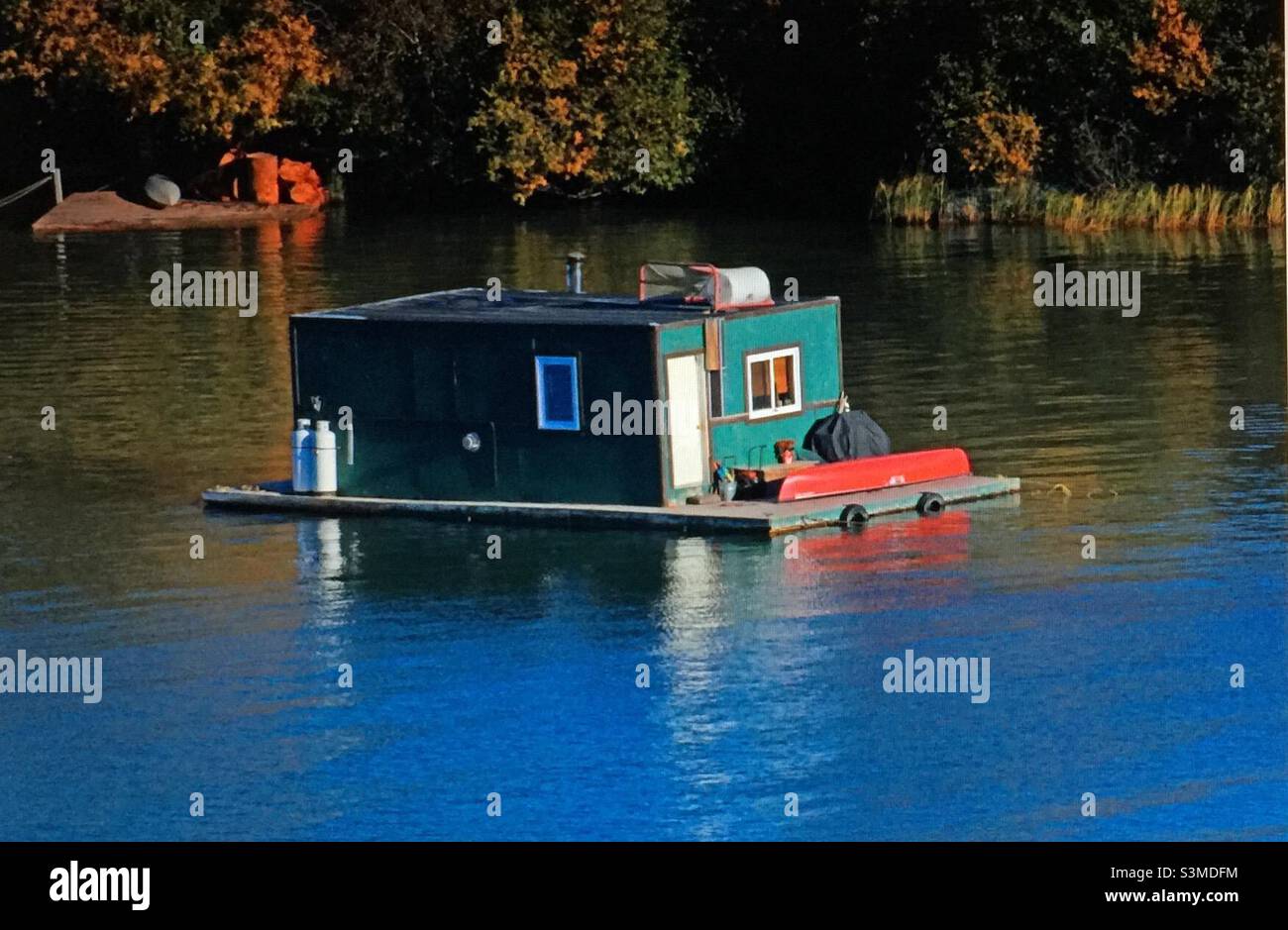 Floating summer cabin, autumn colours, fall, forest, lakeside