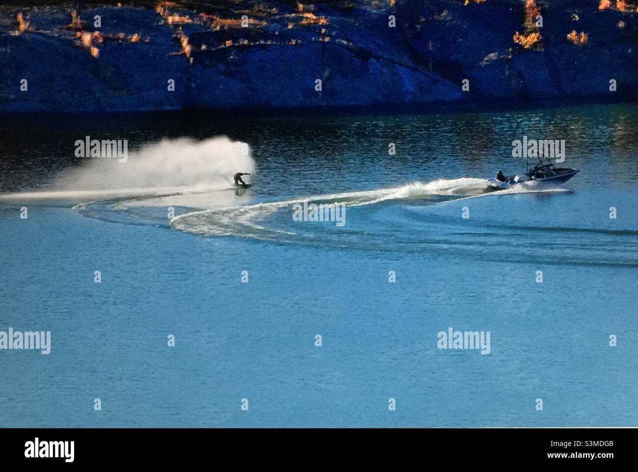 Water skiing, Great Slave Lake, motor boat, white water, speed, sports, power, Yellowknife, Northwest Territories, Canada - Smartphone Captured Stock Image