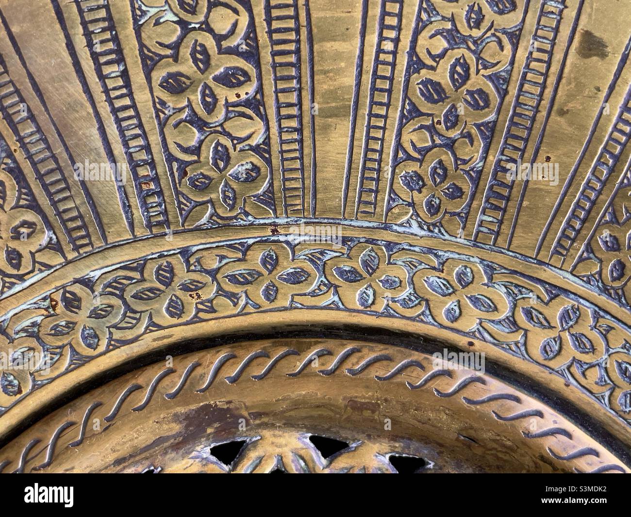 A detail of a middle eastern brassware incense burner - Smartphone Captured Stock Image