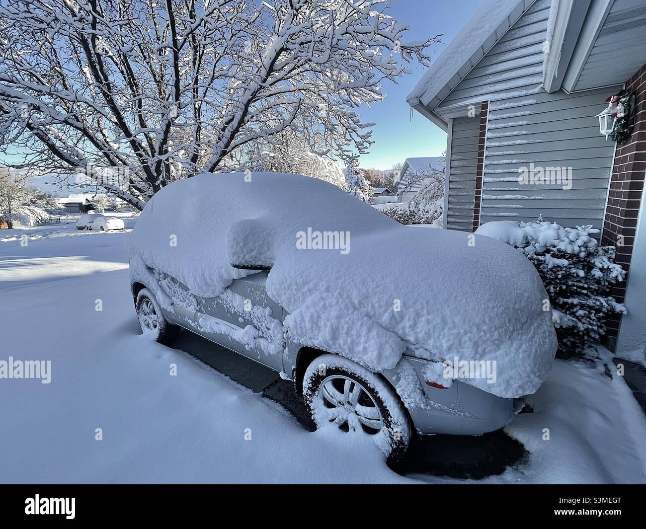 A foot of fresh snowfall in Utah, USA before any of the brushing, scraping or shoveling has been done. - Smartphone Captured Stock Image