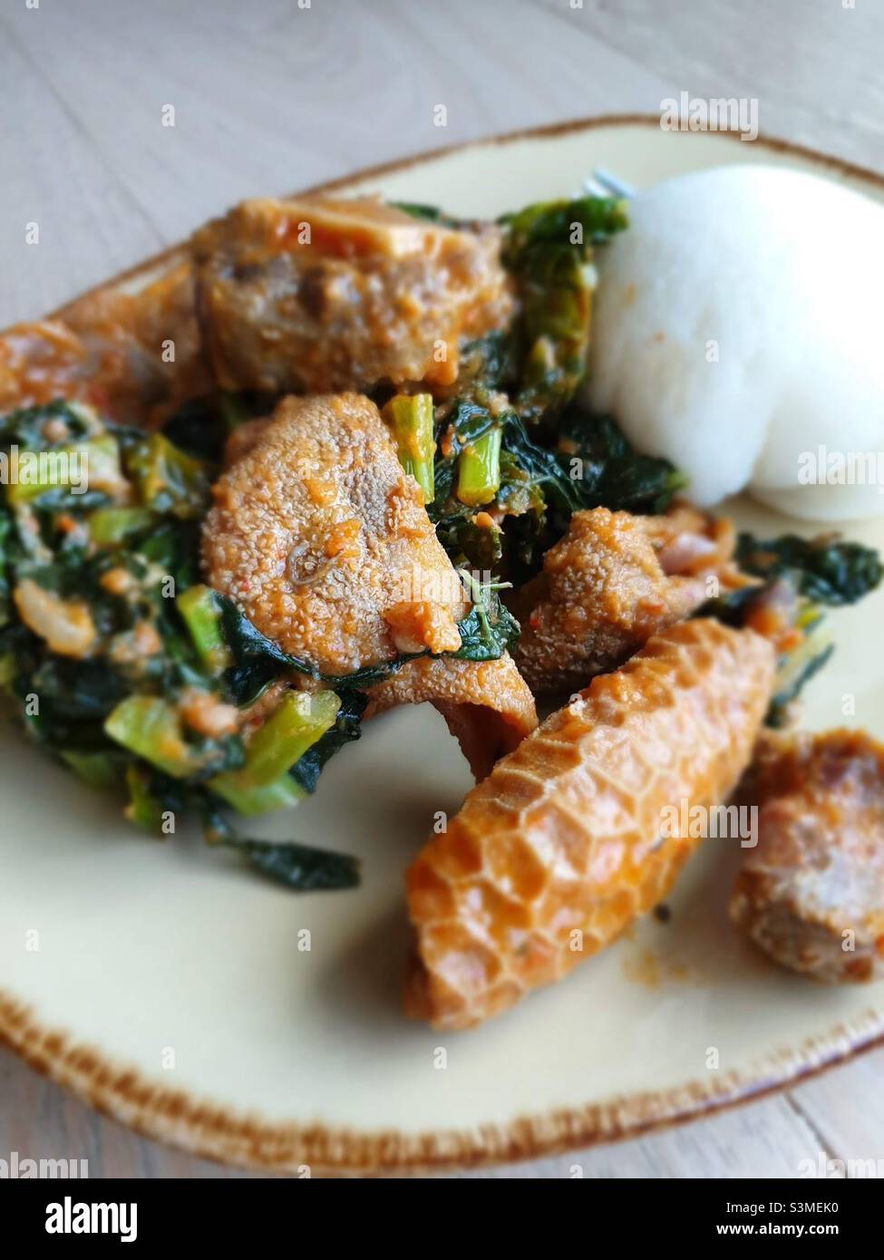 Meat and vegetable stew with cornmeal ball or sadza, meat includes