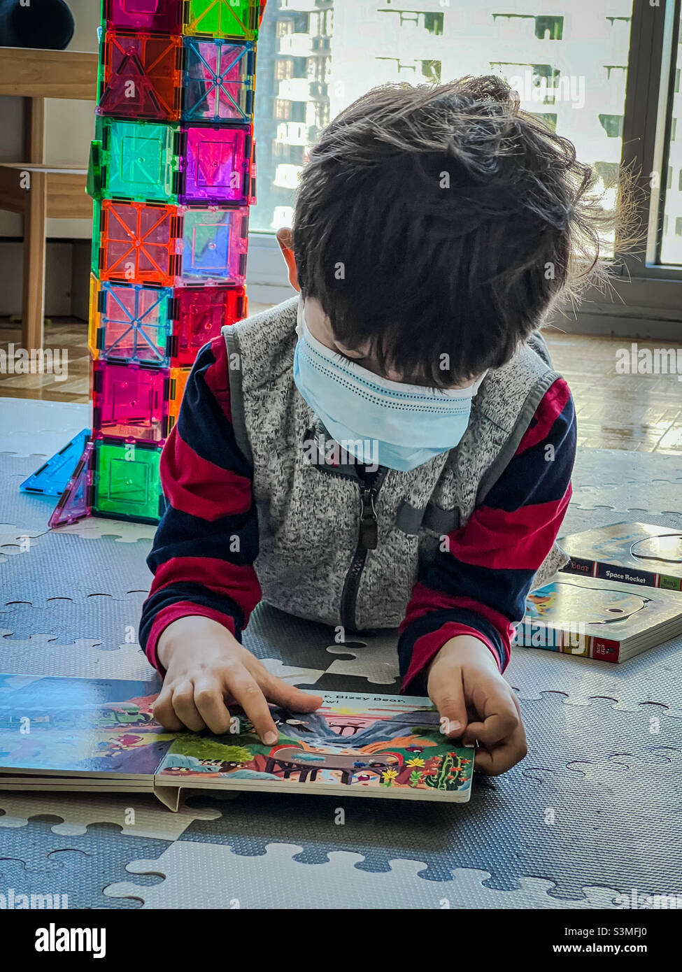 4 years old boy in isolation at home during Covid - Omicron time - Smartphone Captured Stock Image