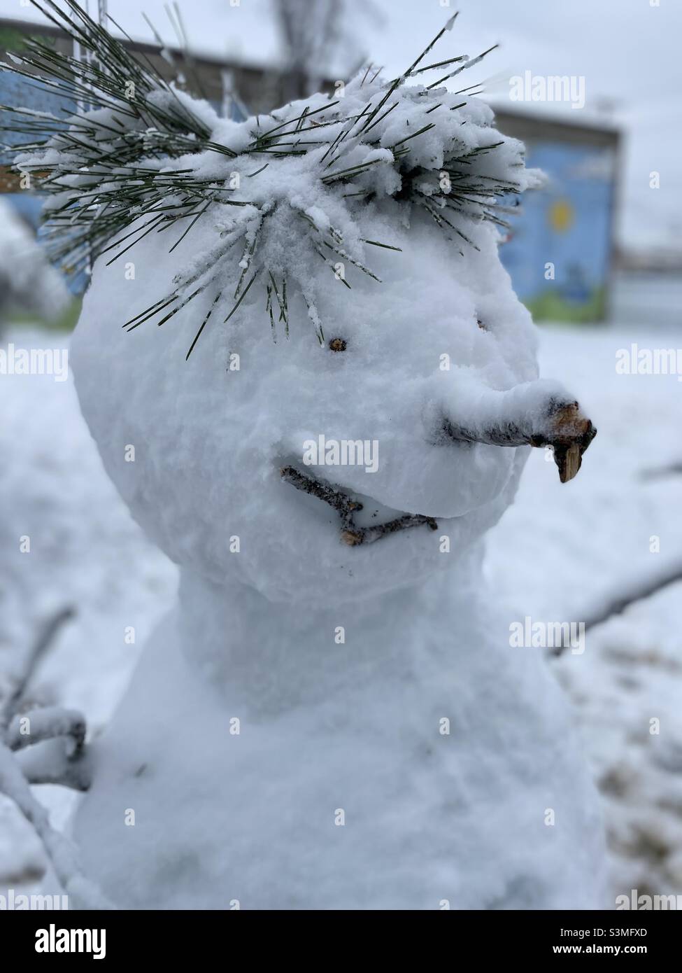 Funny snowman with a long nose and spikey hair. Stock Photo