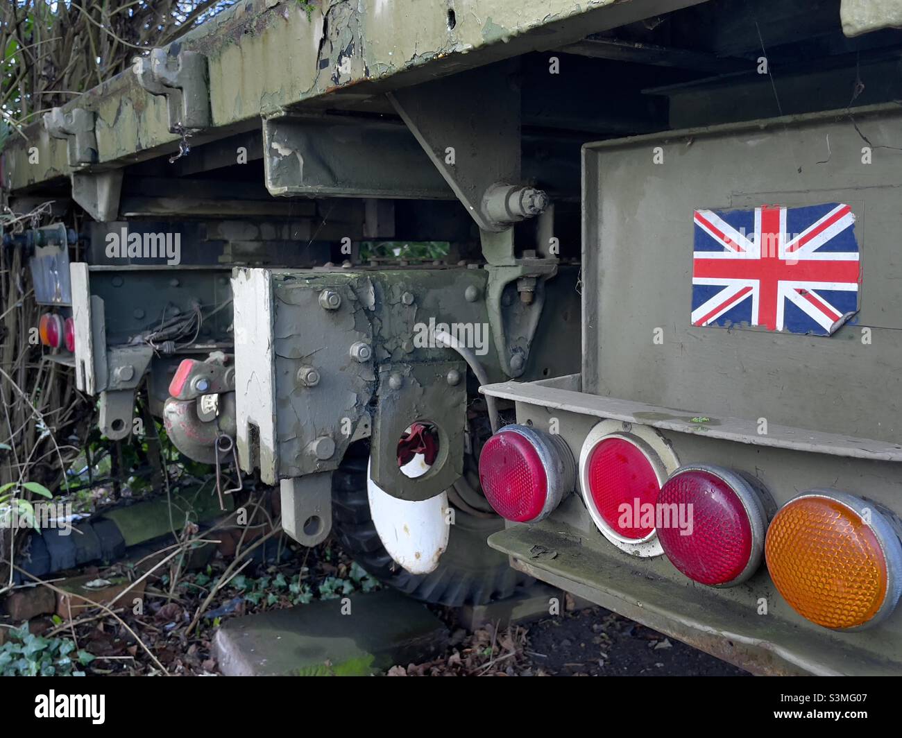 The rear of a World War II army lorry, with modern tail lights And reflectors and a Union Jack sticker Stock Photo