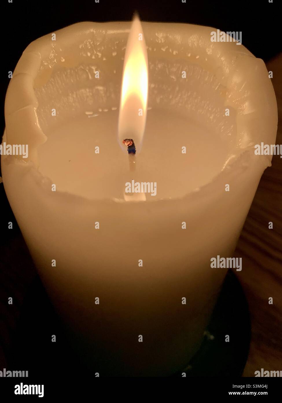 Burning candle flame Stock Photo