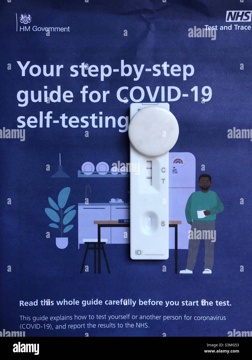 UK NHS self testing kit Lateral flow test showing positive test result for Covid-19 Stock Photo