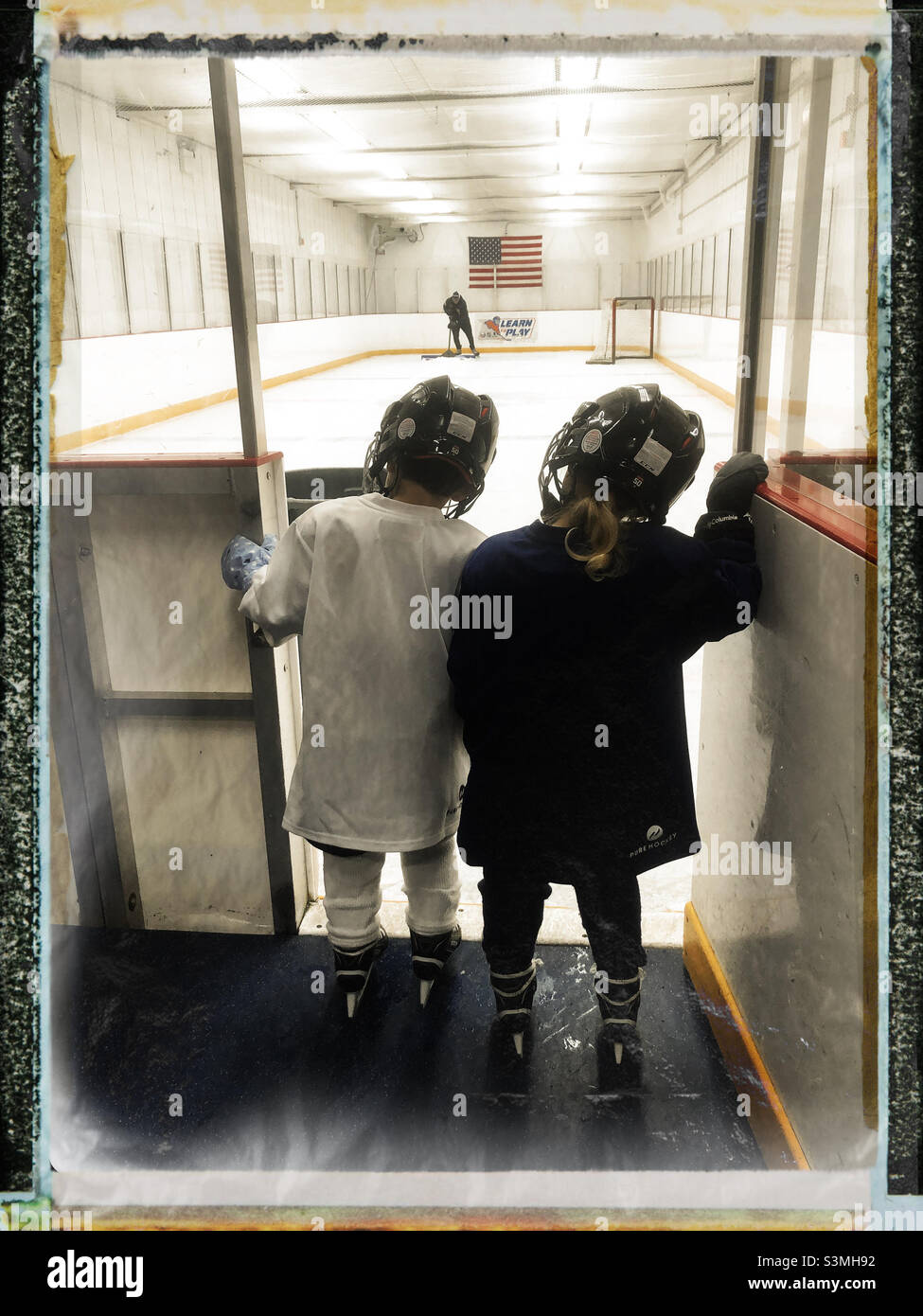 Best friends and teammates ice hockey players waiting to get into the ice ring for their practice - Smartphone Captured Stock Image