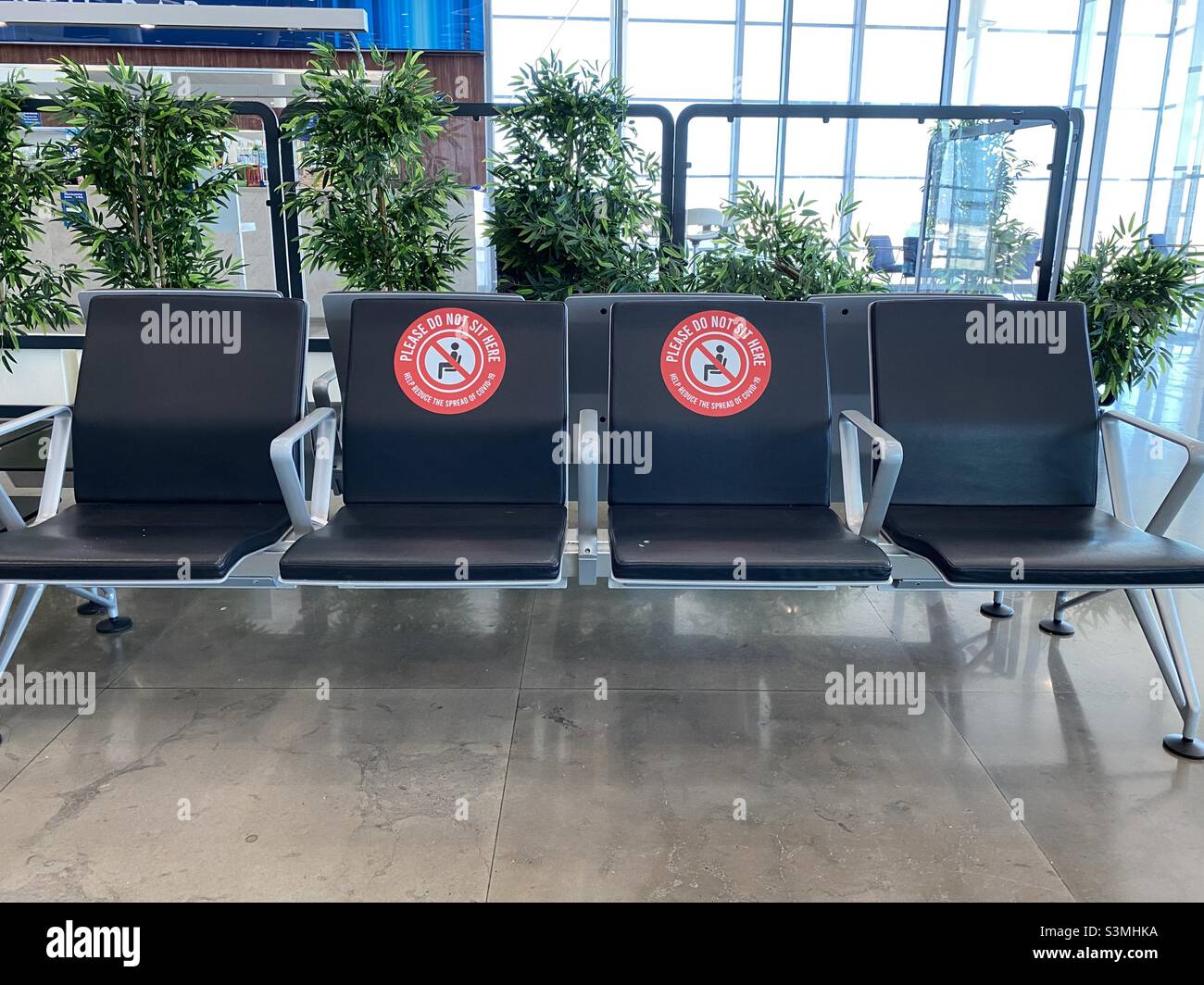 Social distancing in an airport - Smartphone Captured Stock Image
