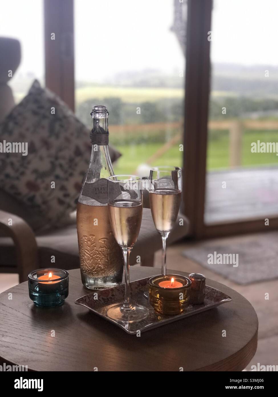 Fizz Celebrate romantic Prosecco candlelight - Smartphone Captured Stock Image