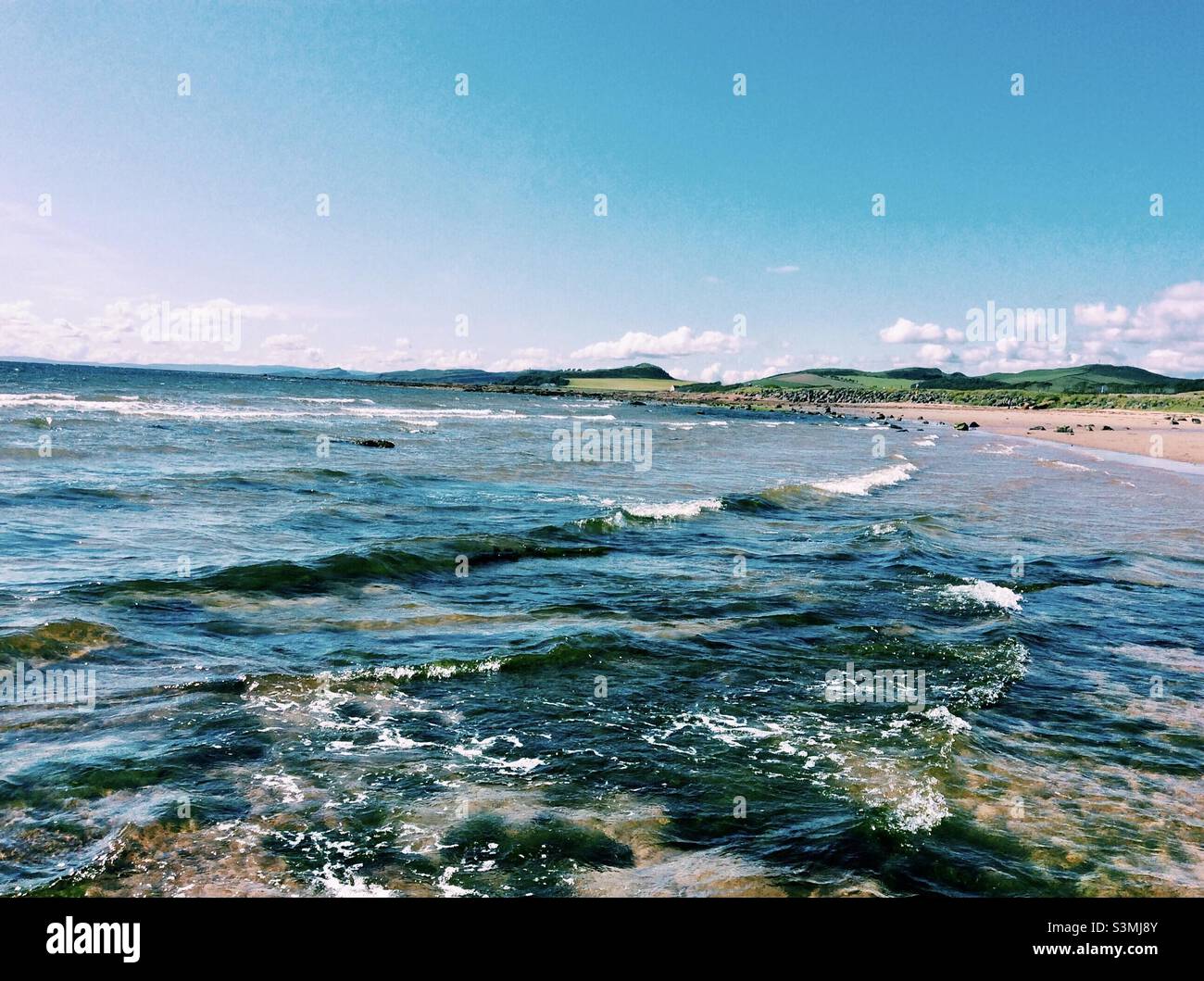 Sea waves ripping over rocks at Seamill Beach, Seamill, West Kilbride, North Ayrshire, Scotland