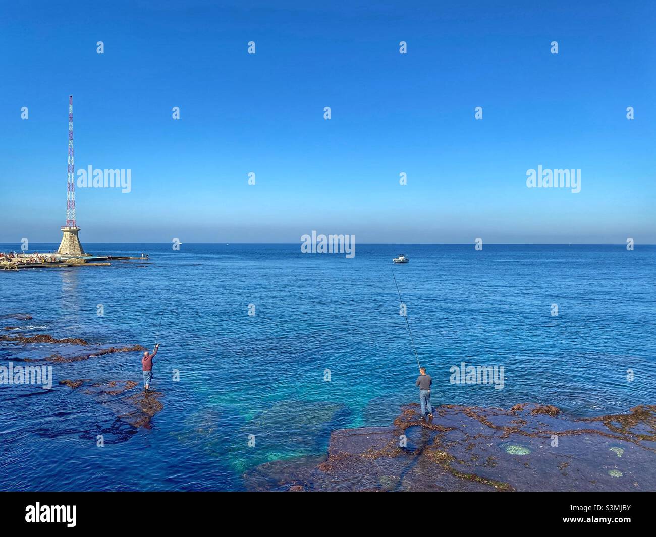 Two men fishing in Beirut Lebanon - Smartphone Captured Stock Image