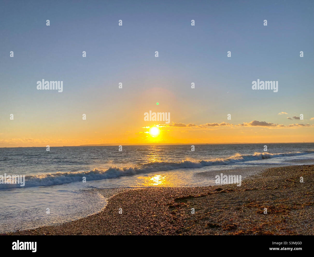 Hayling Island beach at sunset in winter Stock Photo