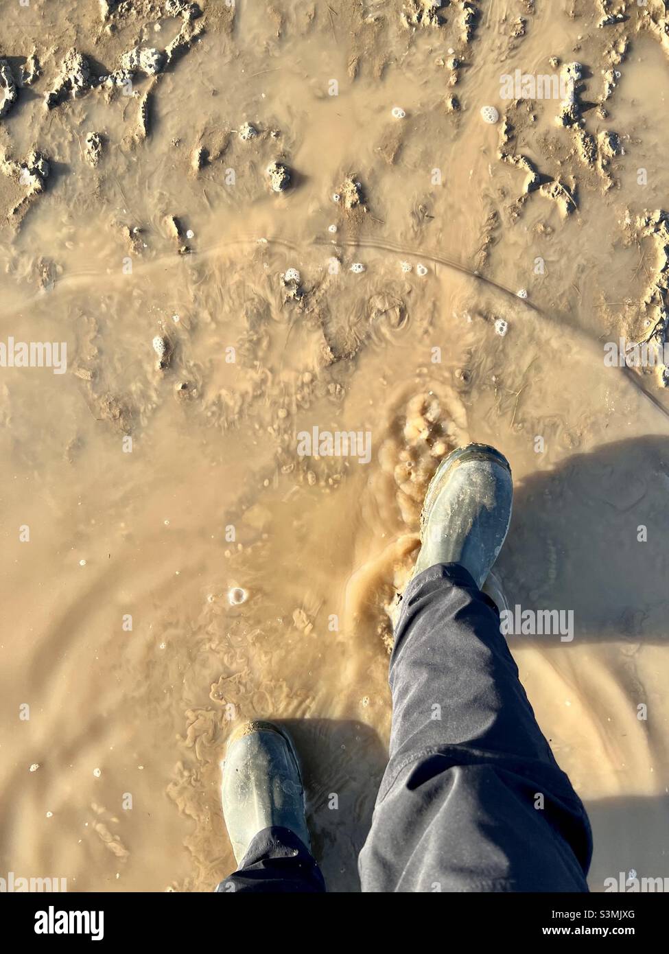 Splashing through a muddy puddle - Smartphone Captured Stock Image
