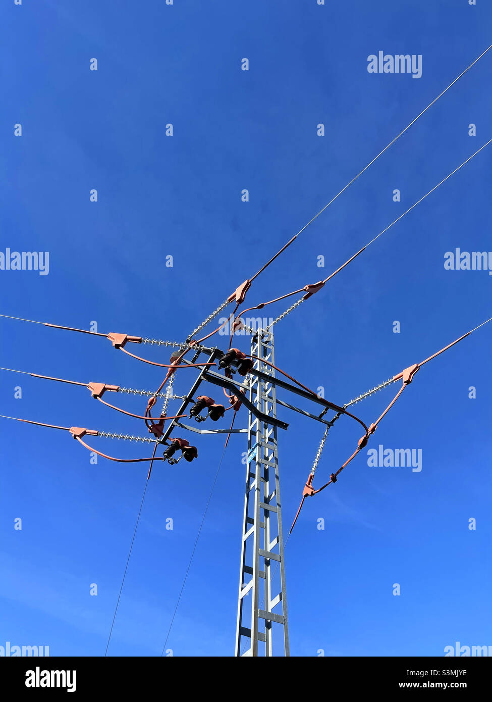 Electricity pylon against blue sky. - Smartphone Captured Stock Image