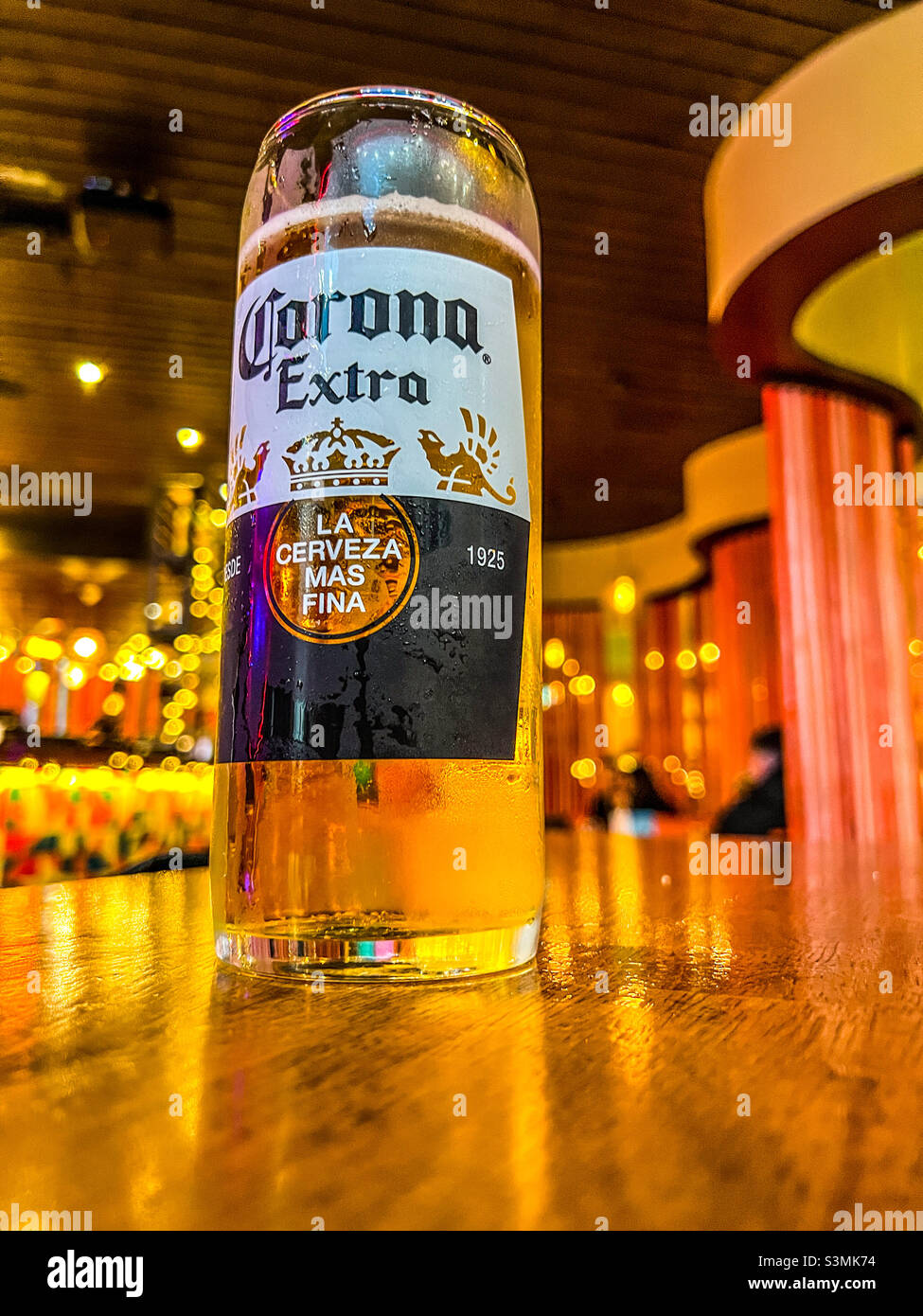 Pint glass of Corona Extra lager in bar Stock Photo
