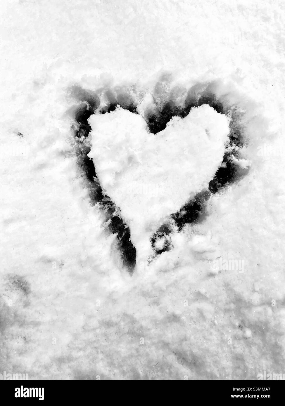A heart carved into snow - Smartphone Captured Stock Image