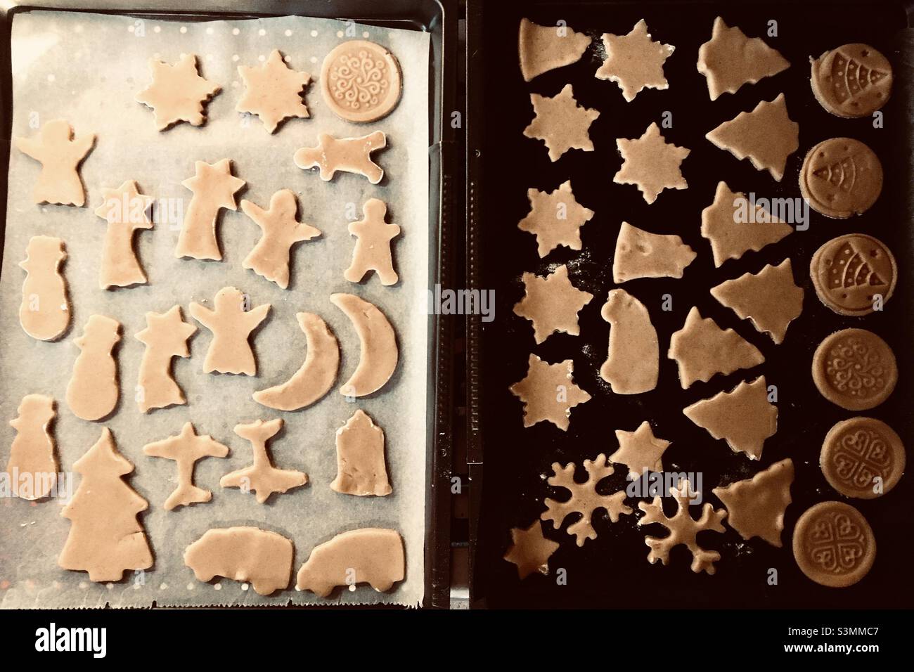 Gingerbread shapes on baking pan ready to be baked Stock Photo