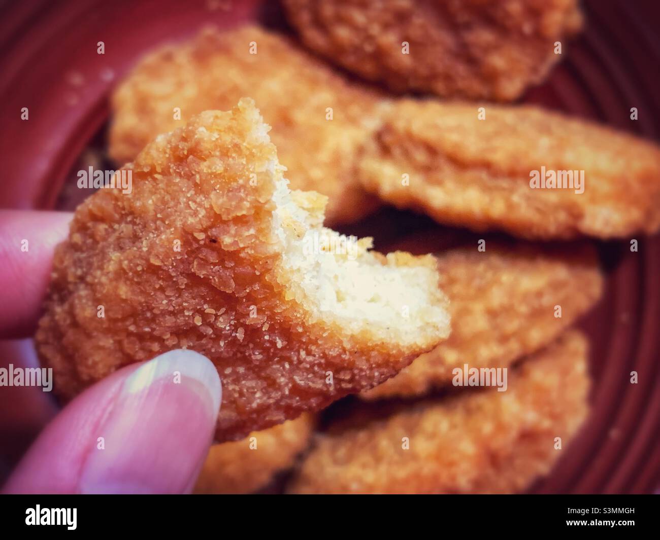 A bite of a nugget. - Smartphone Captured Stock Image