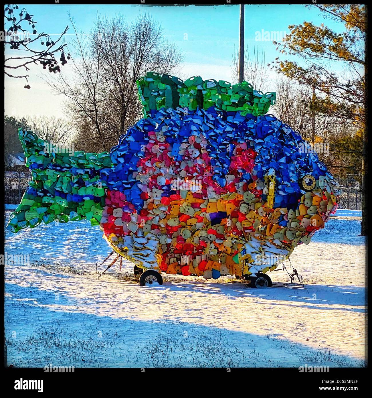 Huge colorful fish made from recycled materials Stock Photo