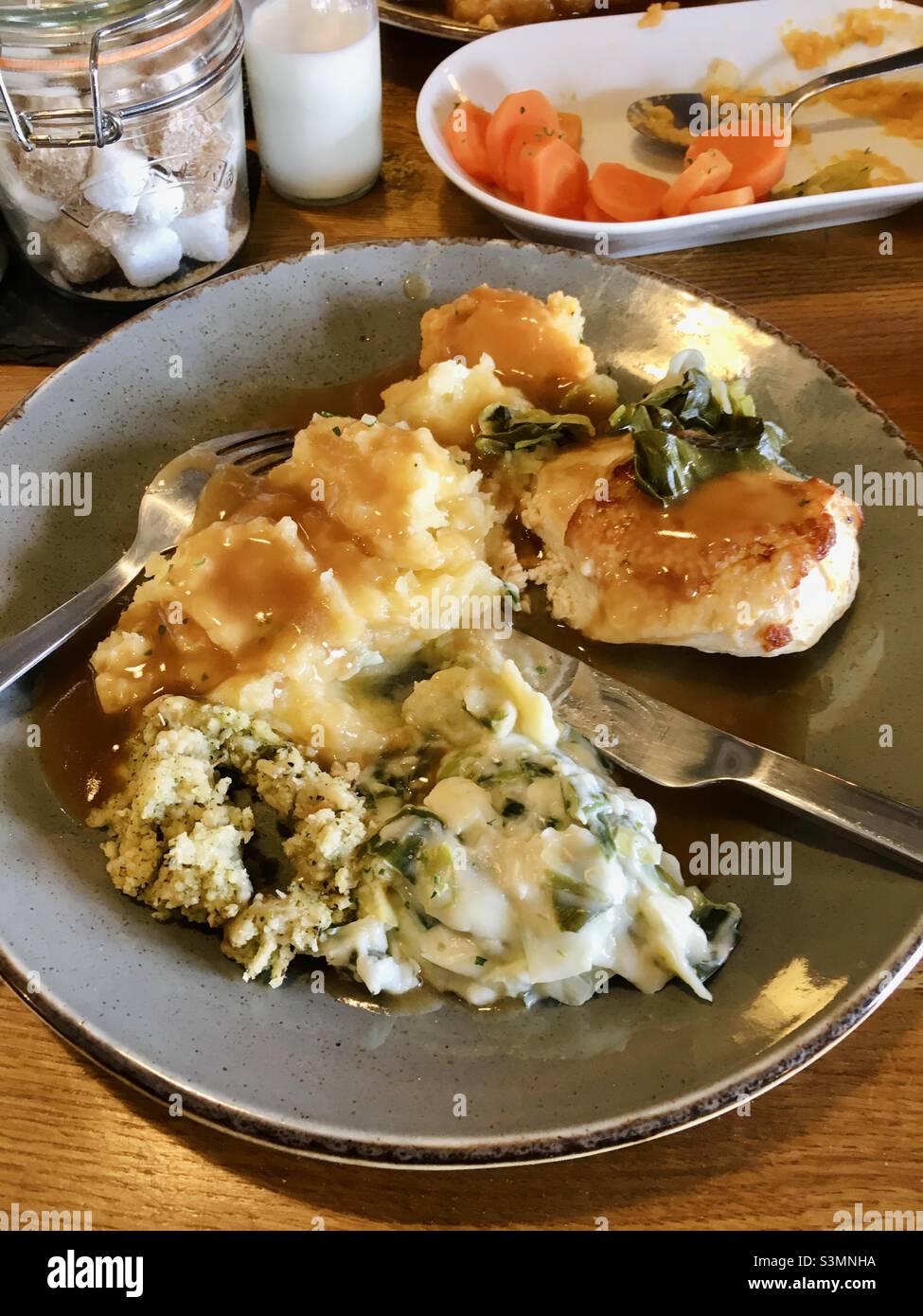 Traditional British Sunday roast dinner with chicken meat potatoes stuffing and all the