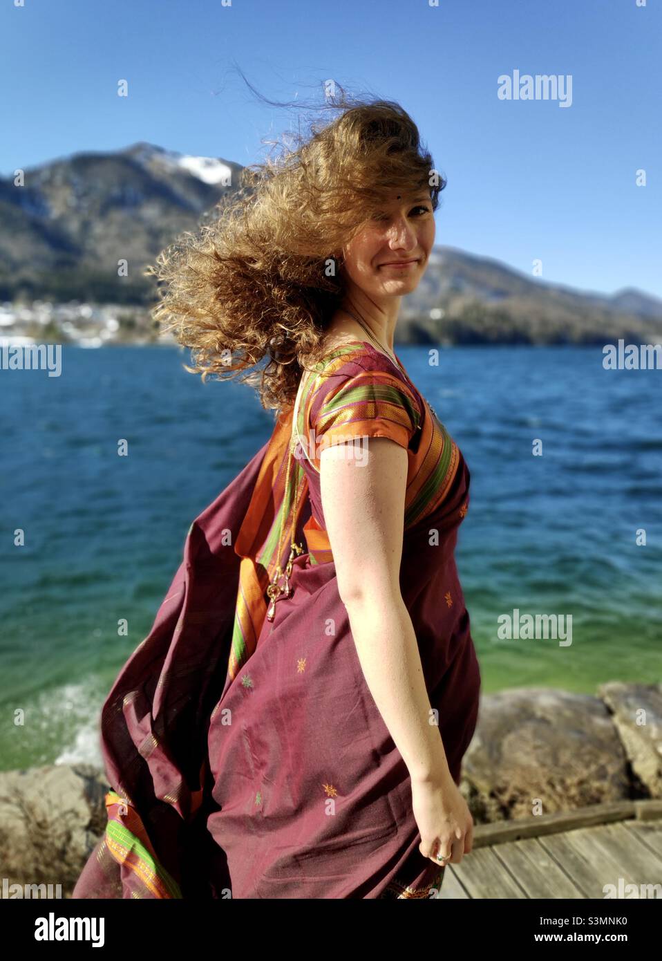 A candid portrait of a woman in natural light near lake fuschlsee in Austria Stock Photo