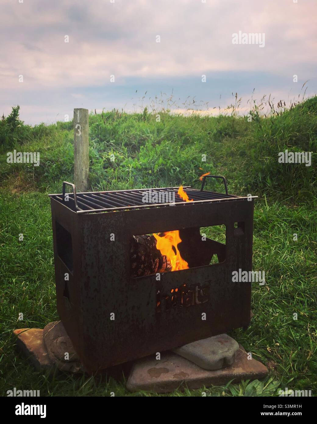 BBQ Fire pit camping Cornwall uk summer beach - Smartphone Captured Stock Image