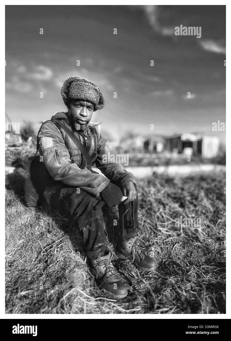 A young black man at the allotment. - Smartphone Captured Stock Image