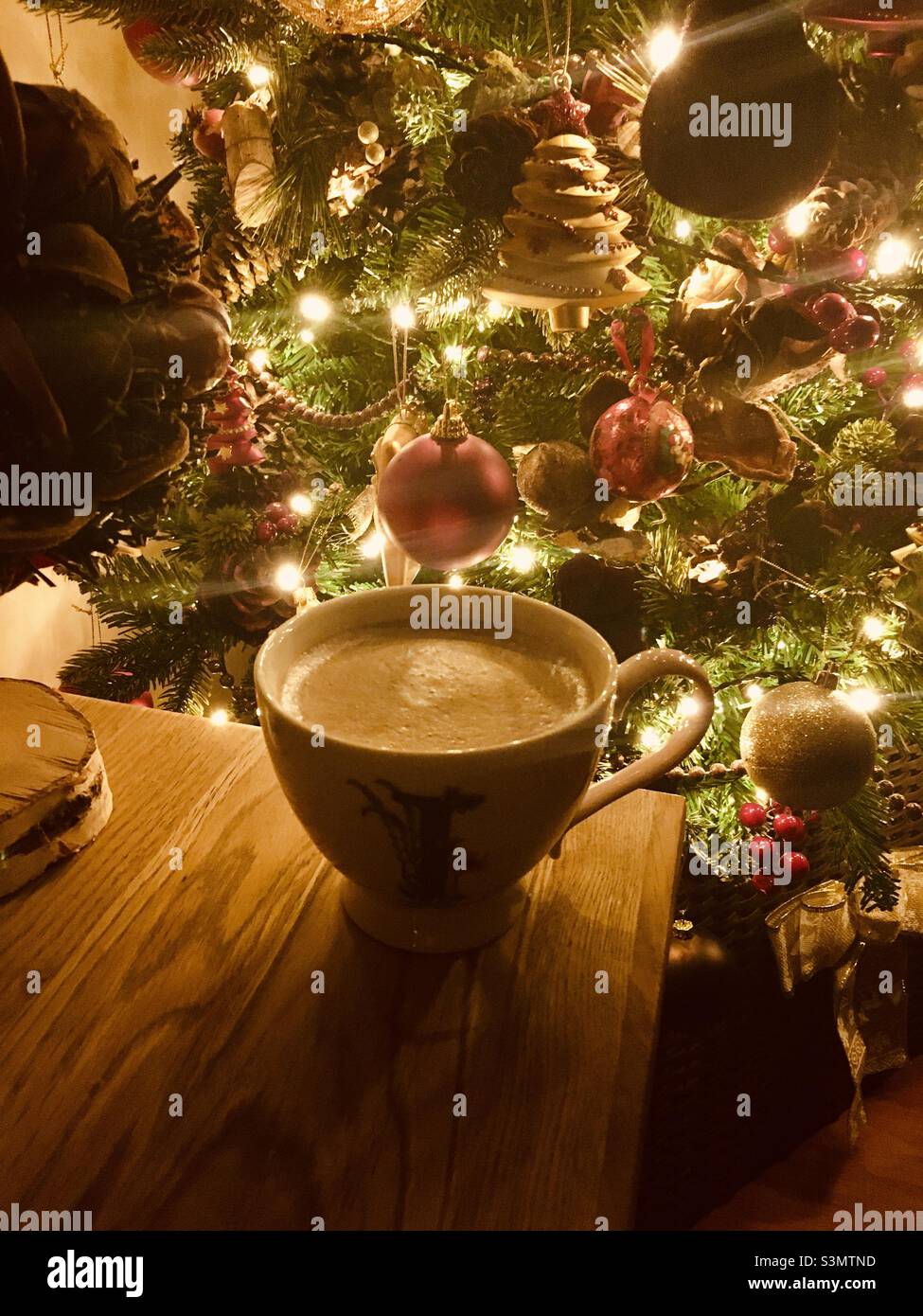 Cody cup of coffee next to the Christmas tree in Wales UK Stock Photo