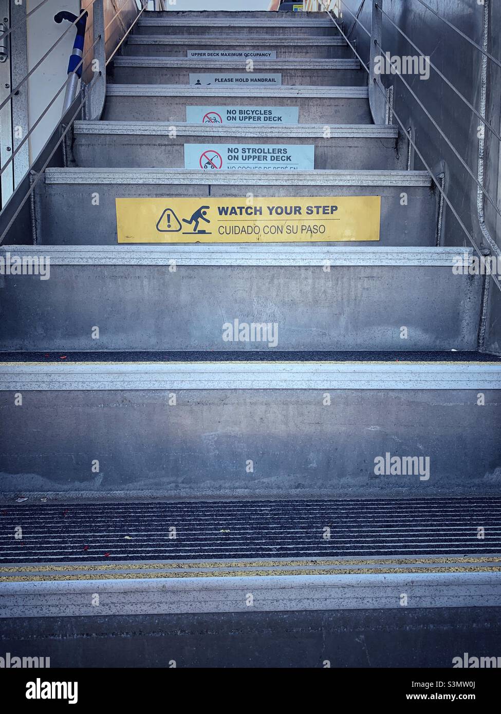 Watch your step. Cuidado con su paso. Stock Photo