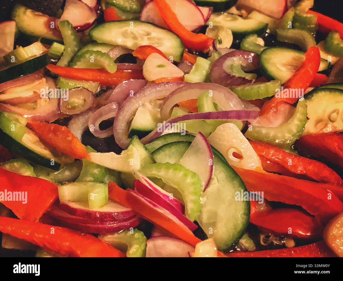 Mixed vegetables in the skillet cooking at home. - Smartphone Captured Stock Image