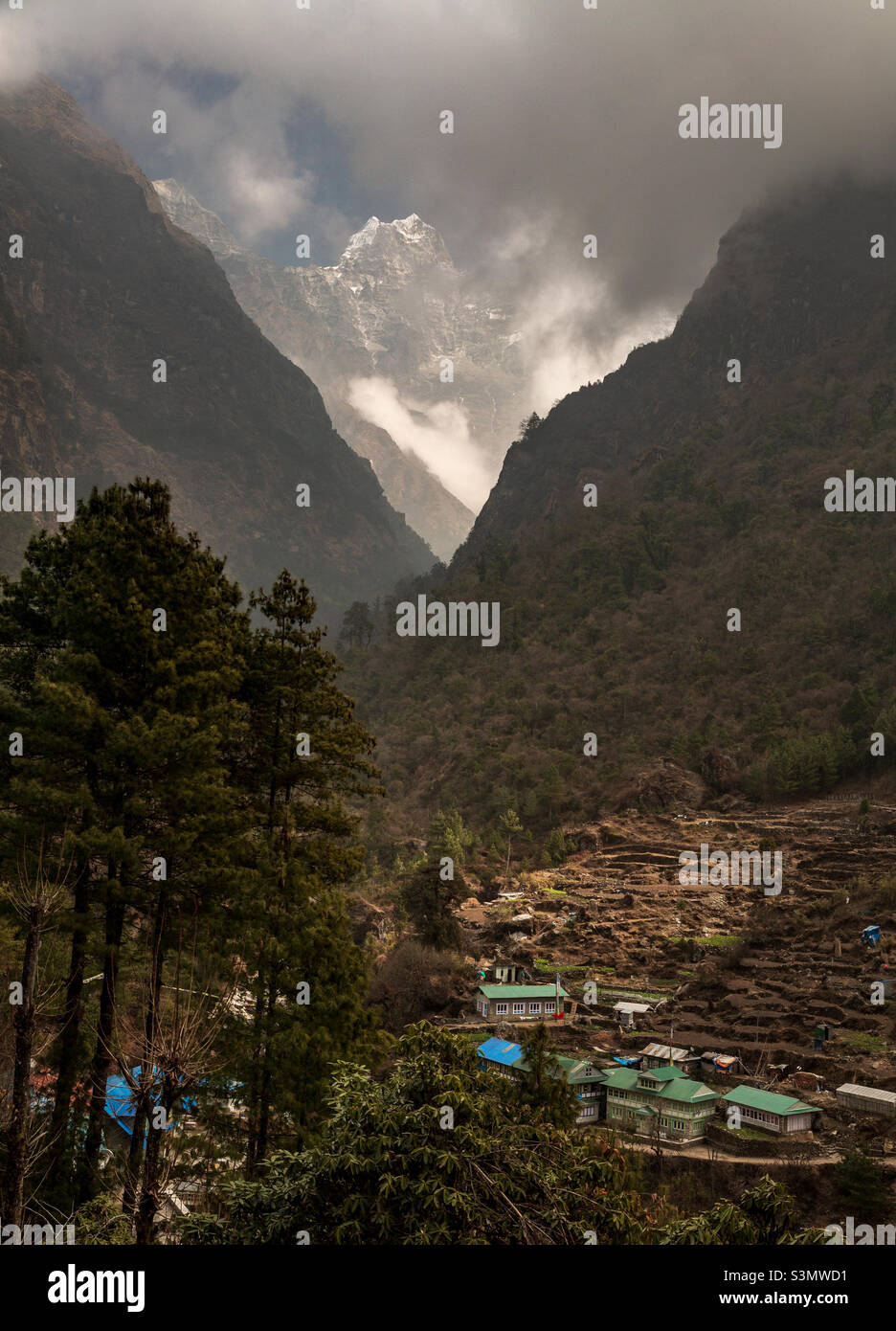 Himalayan peak Khusum Kangru appeared through the clouds, Nepal - Smartphone Captured Stock Image