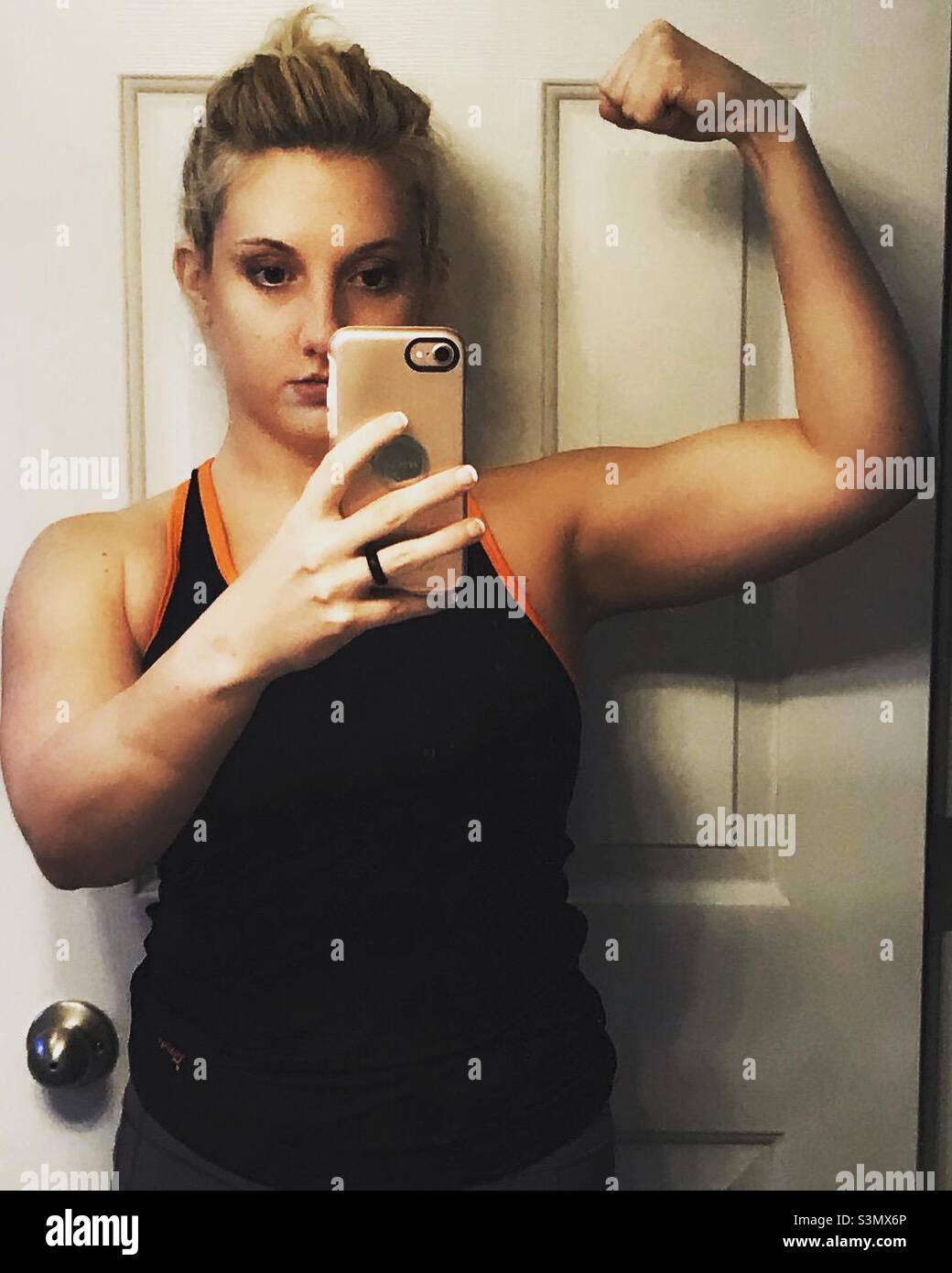 Woman flexing selfie Stock Photo Alamy