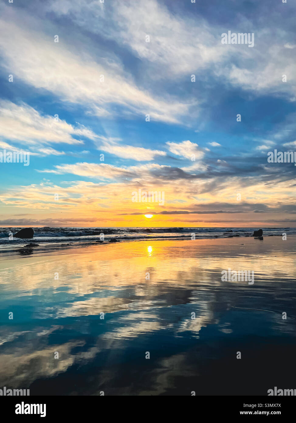 Low angle view of dramatic sunset at beach Stock Photo