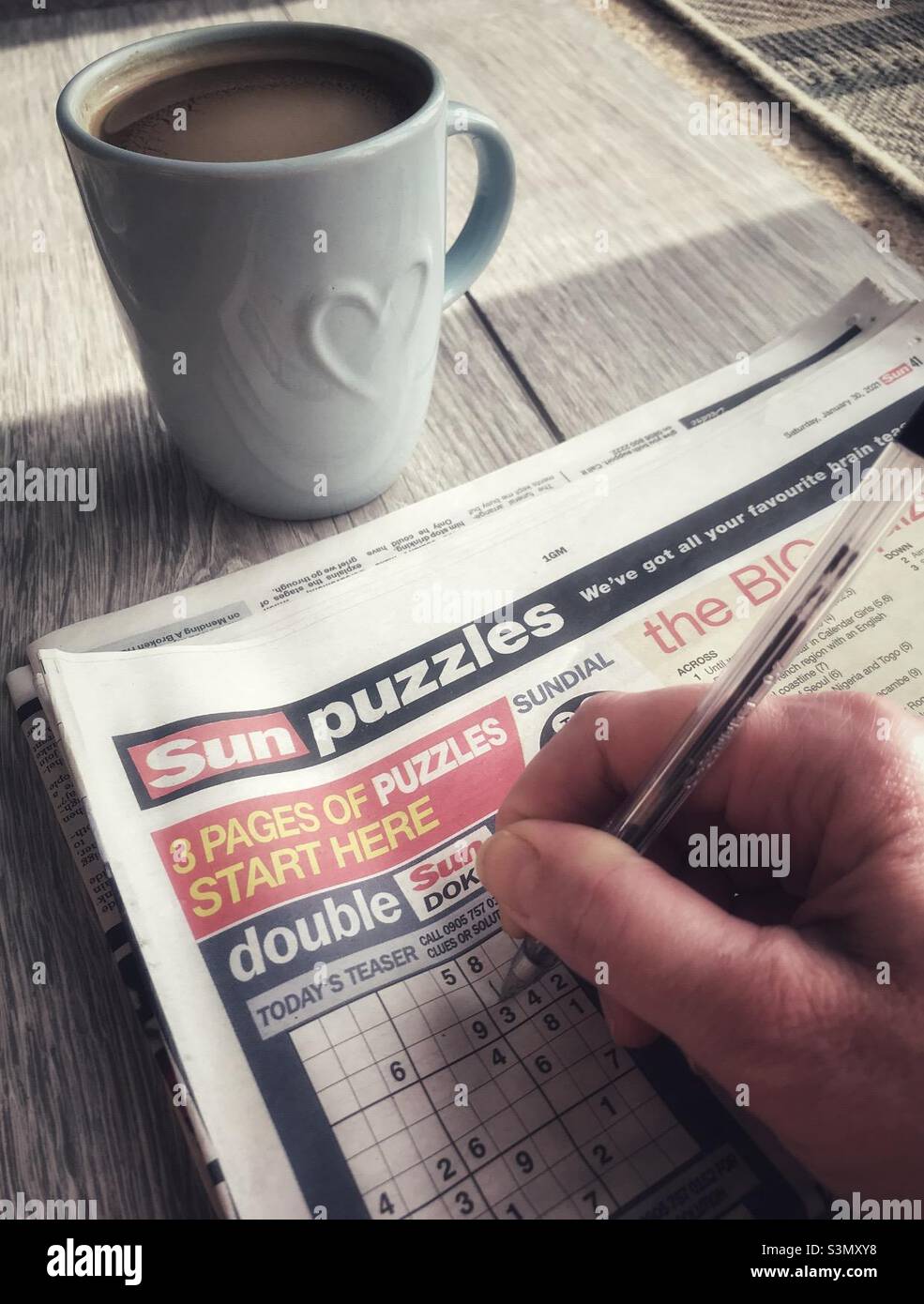 Morning Sudoku With A Mug Of Oat Latte Stock Photo Alamy