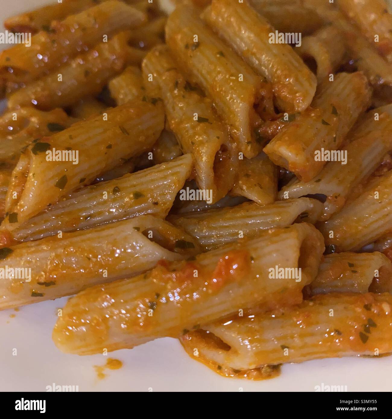 Pasta in tomato pesto Stock Photo