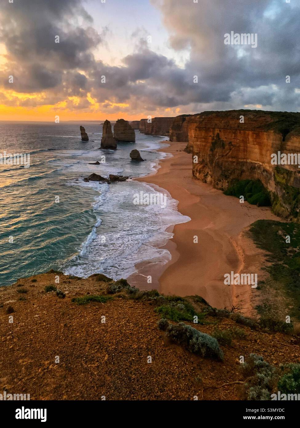 Twelve Apostles at sunset on the Great Ocean Road in Victoria, Australia. Stock Photo