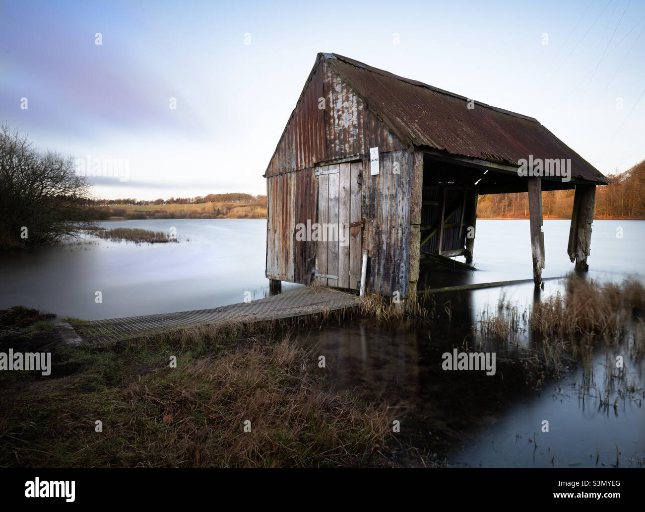 Old fishing hut at dawn Stock Photo - Alamy