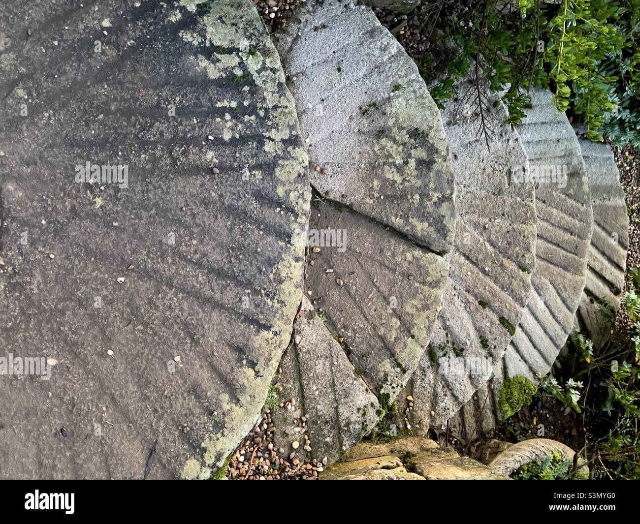 A flight of steps made from recycled millstones in the garden of a country house hotel in Rutland - Smartphone Captured Stock Image
