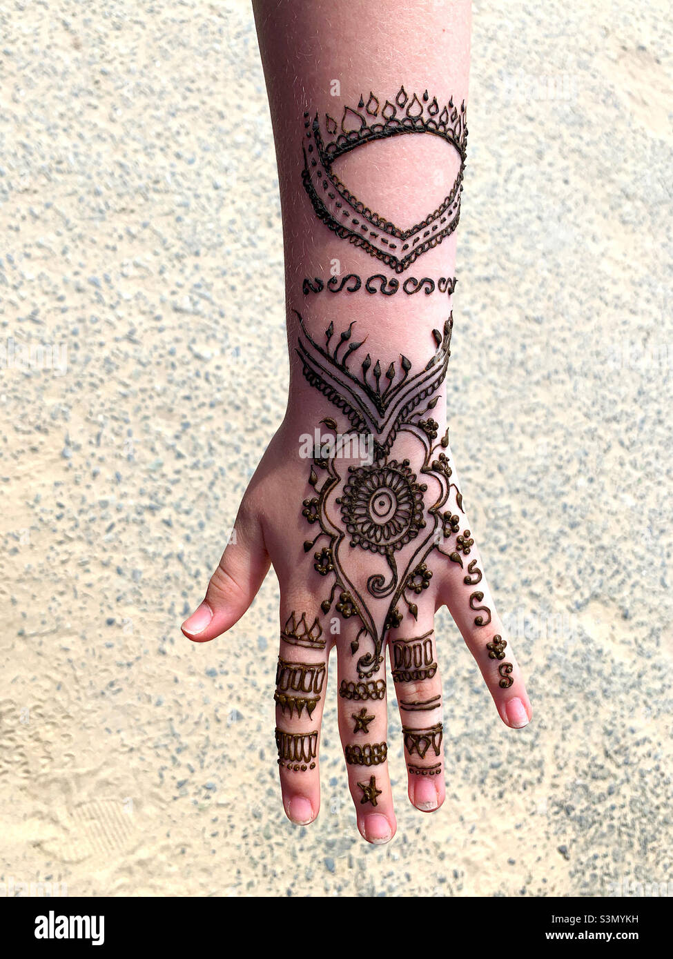 Henna body art on girls arm Stock Photo