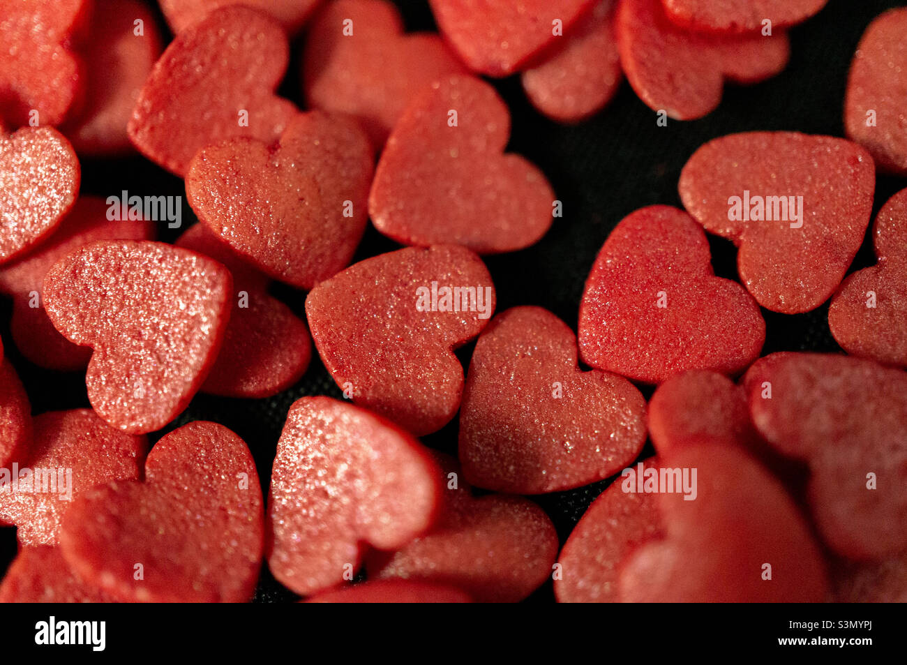 Background with red sugar candy hearts Stock Photo Alamy