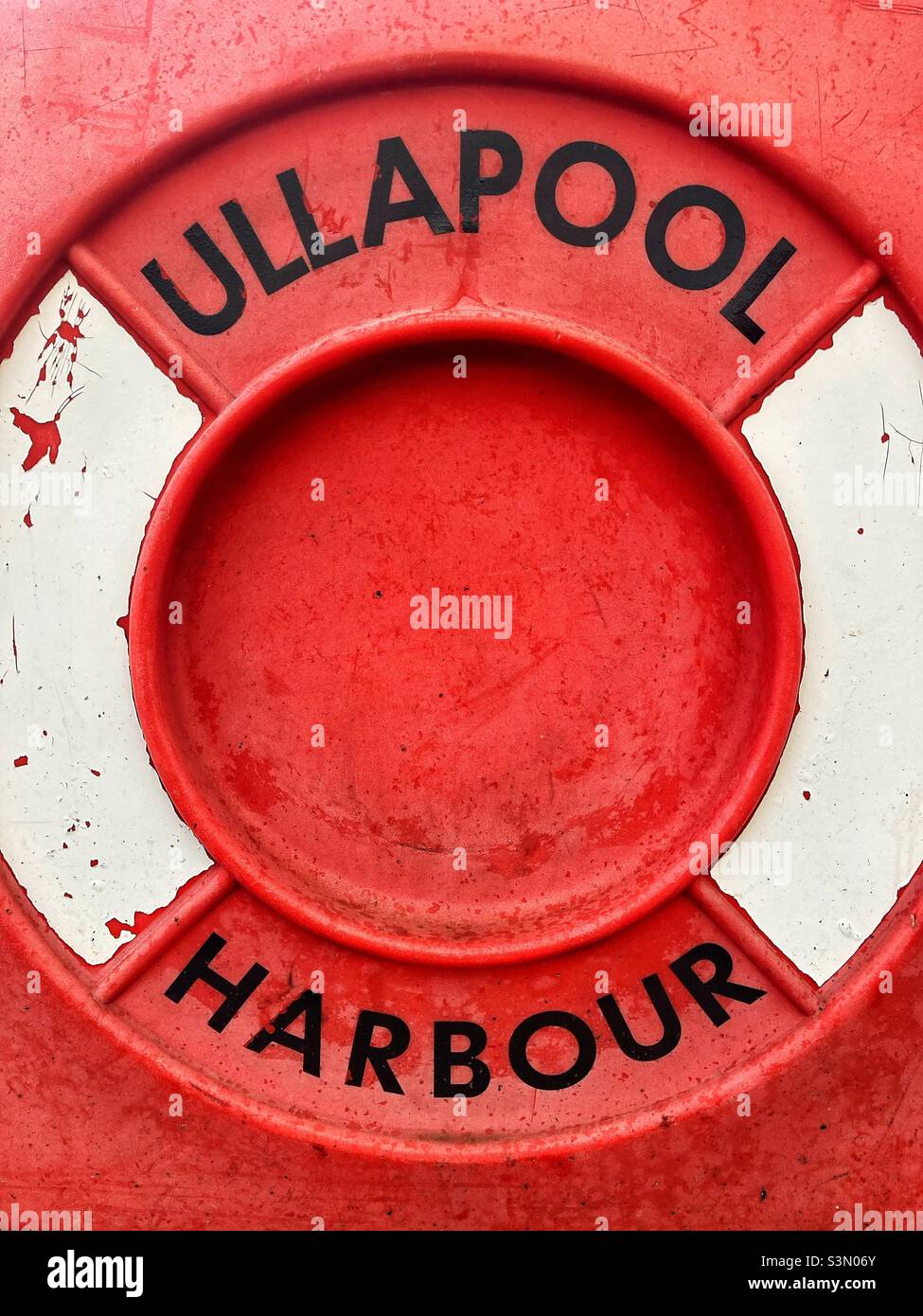 The cover of a life saving device at Ullapool Harbour in the Highlands of Scotland. Stock Photo