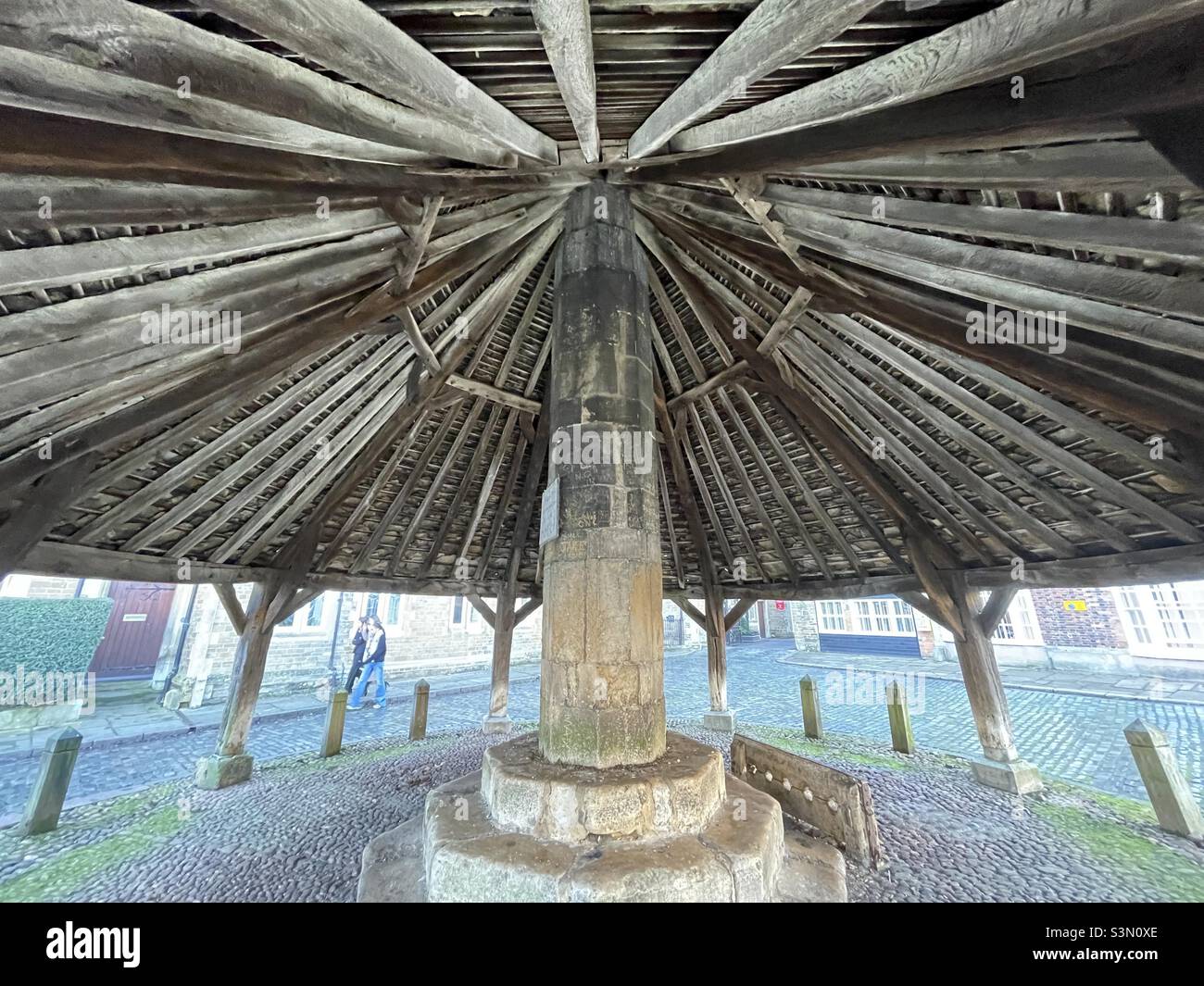 And inside view of the roof canopy of the old Butter Cross market hall in Oakham in Rutland showing the old stocks - Smartphone Captured Stock Image