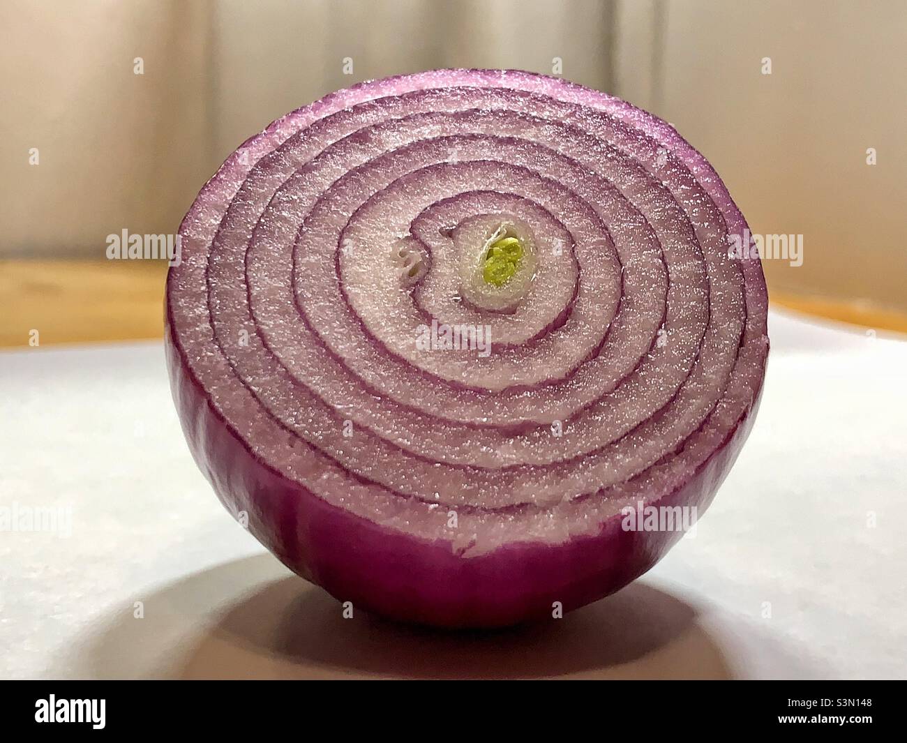 Half slice of onion Stock Photo Alamy