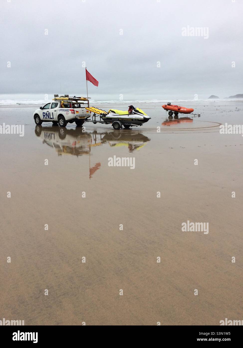 RNLI Red Flag on Perranporth Beach - Smartphone Captured Stock Image