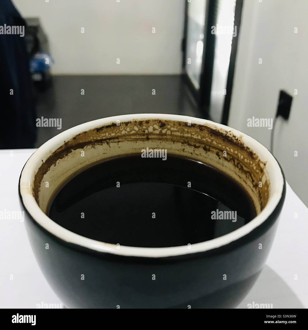 Hot black coffee served in the office on a simple background Stock Photo