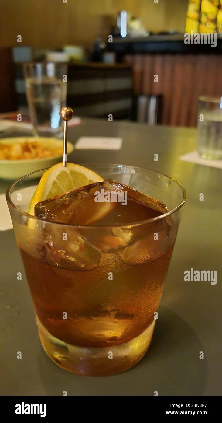 Old fashioned cocktail at a bar Stock Photo
