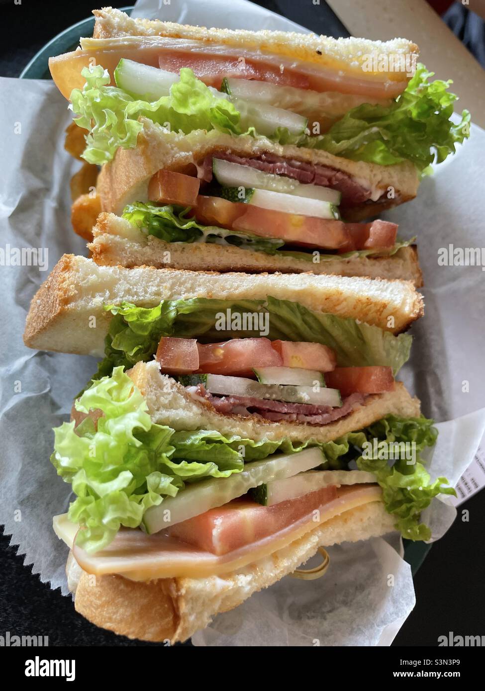 Club sandwiches in a column Stock Photo