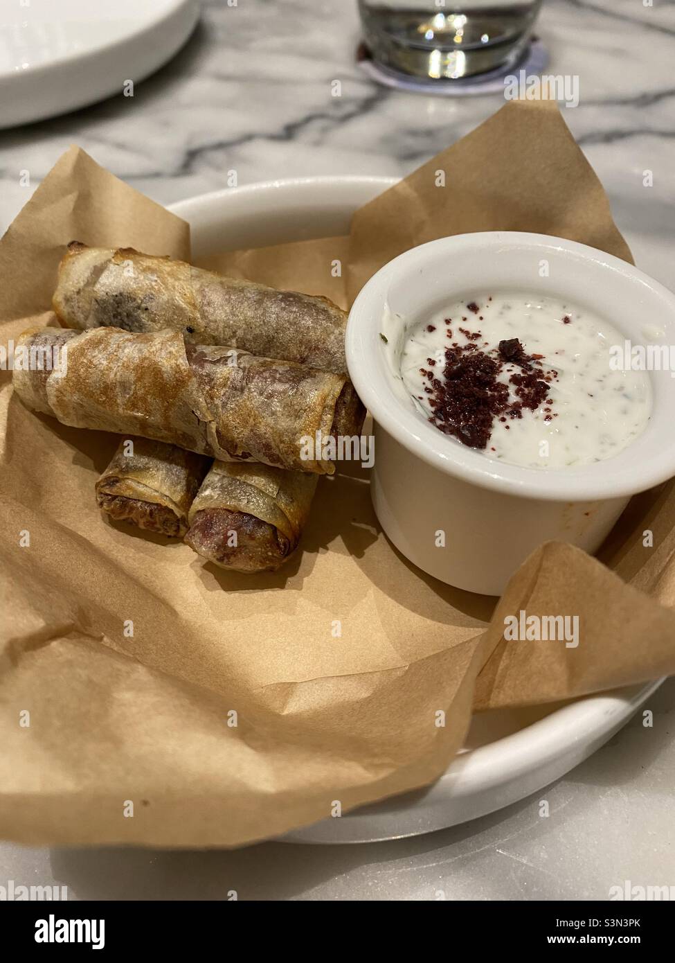 Chicken and sumac spring rolls with yogurt dip Stock Photo Alamy