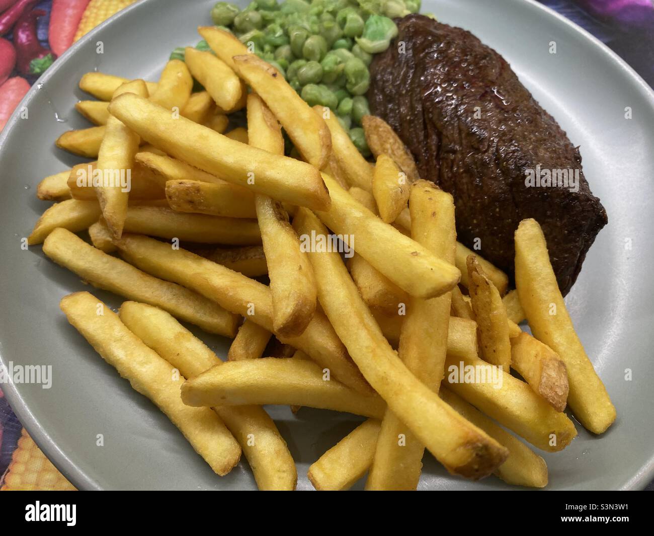 Steak, butter and juices, Marrowfat Peas, Skin on Fries Stock Photo