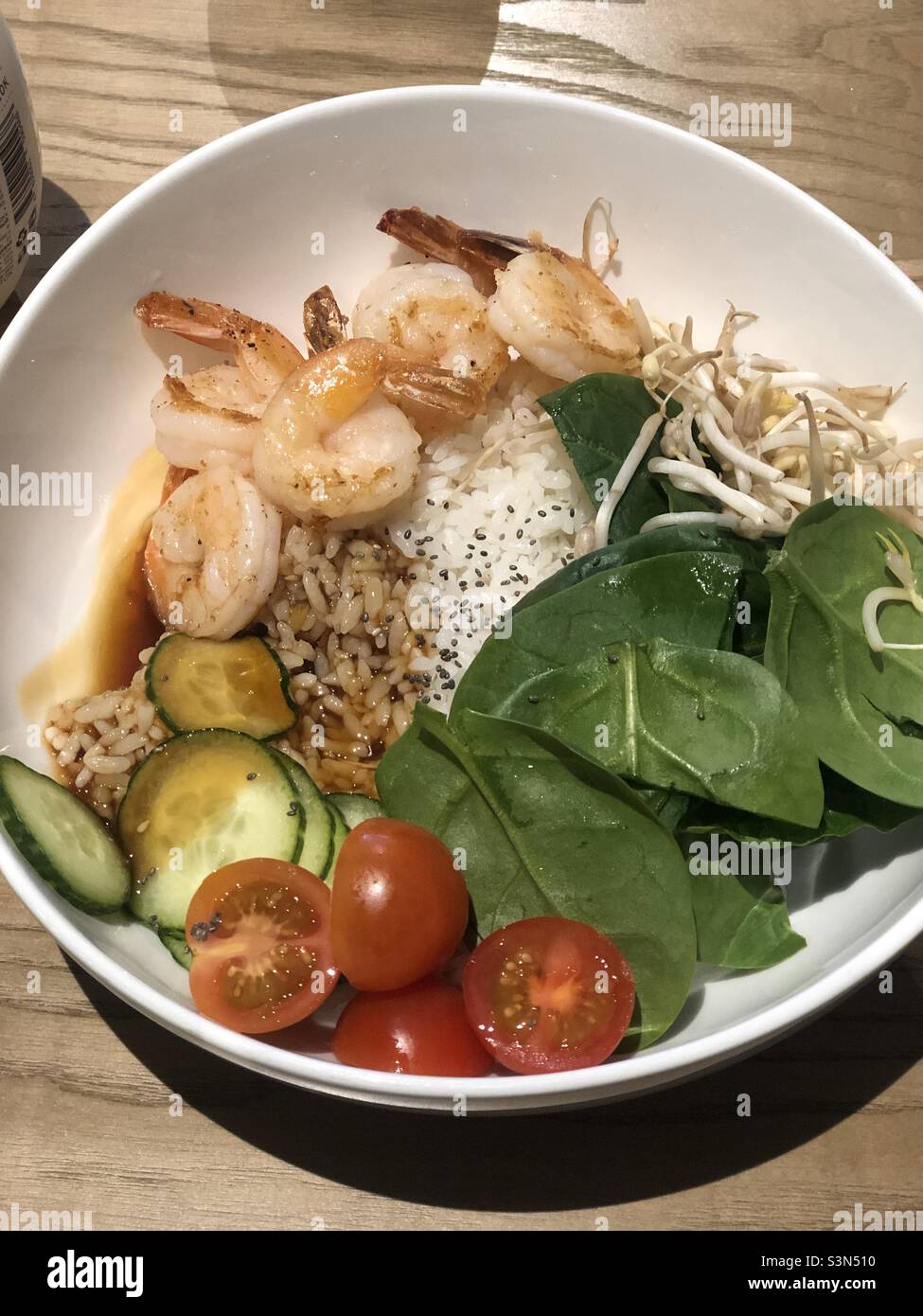 poke bowl with shrimp, rice, spinach and vegetables - Smartphone Captured Stock Image